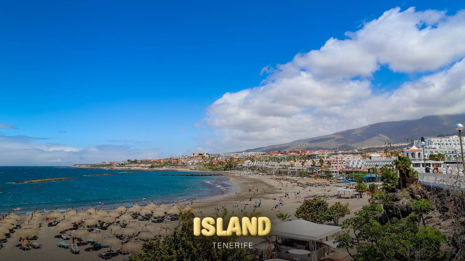 Aerial view of Playa de Torviscas beach in Costa Adeje, Tenerife, with the Party Island Tenerife logo
