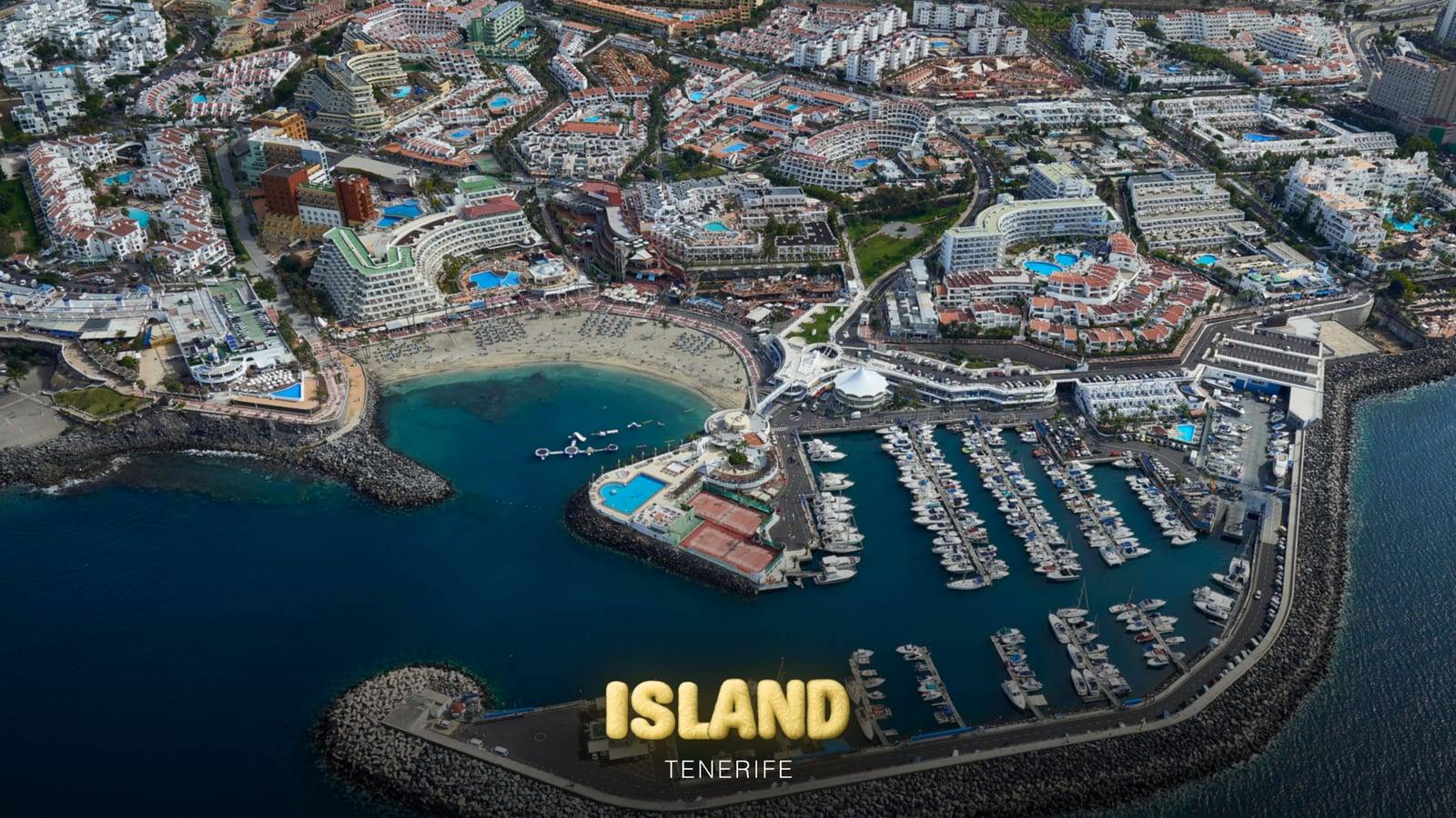 Aerial view of Costa Adeje and its marina next to the beach