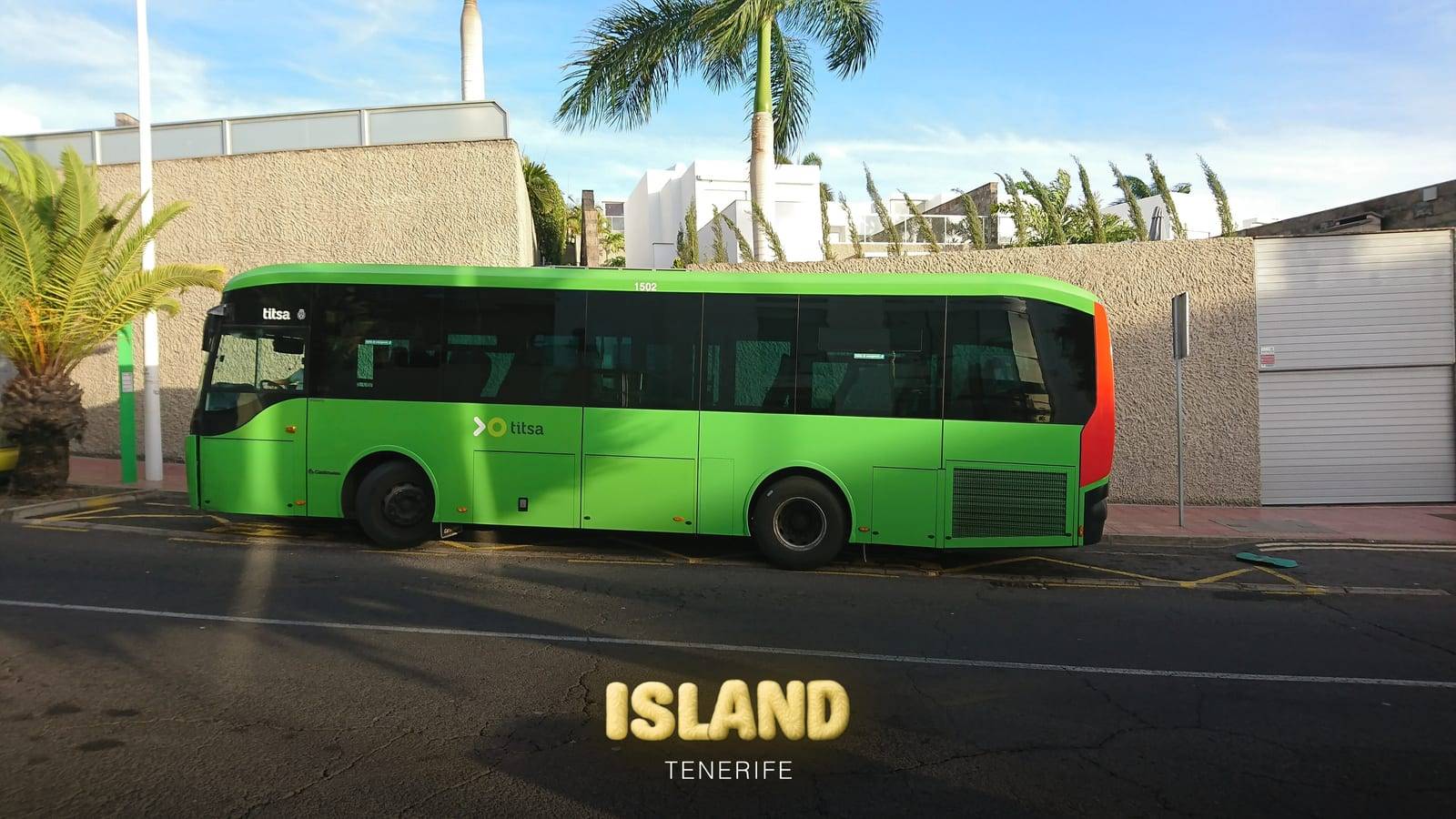 A green TITSA bus at Plaza El Duque, Costa Adeje